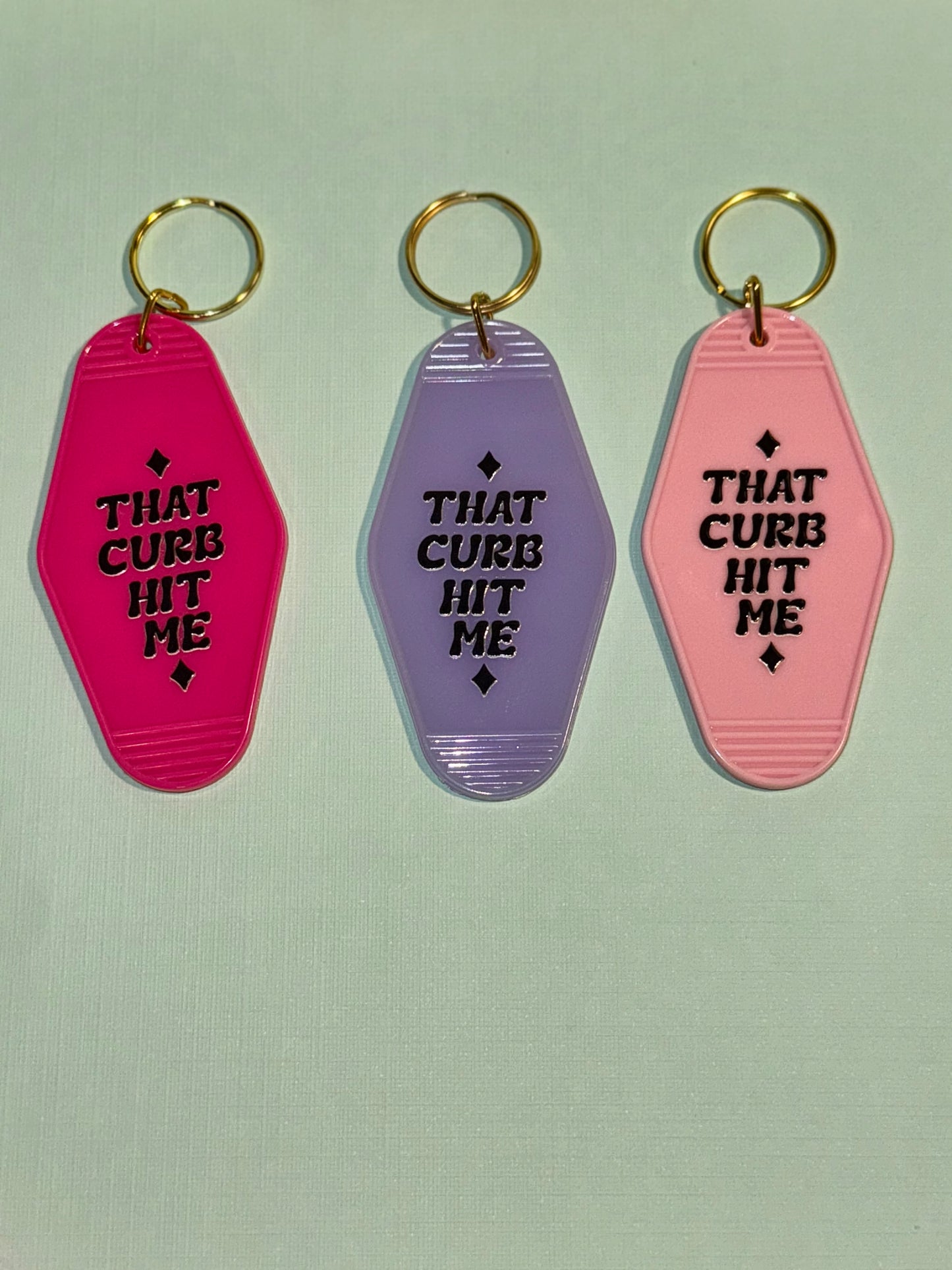 That curb hit me motel keychain