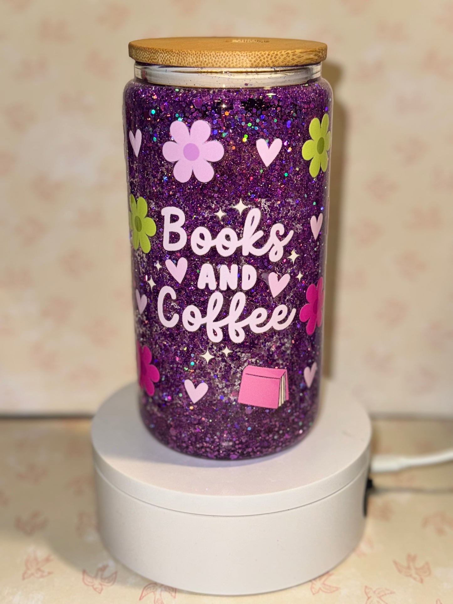 Books and coffee snow globe