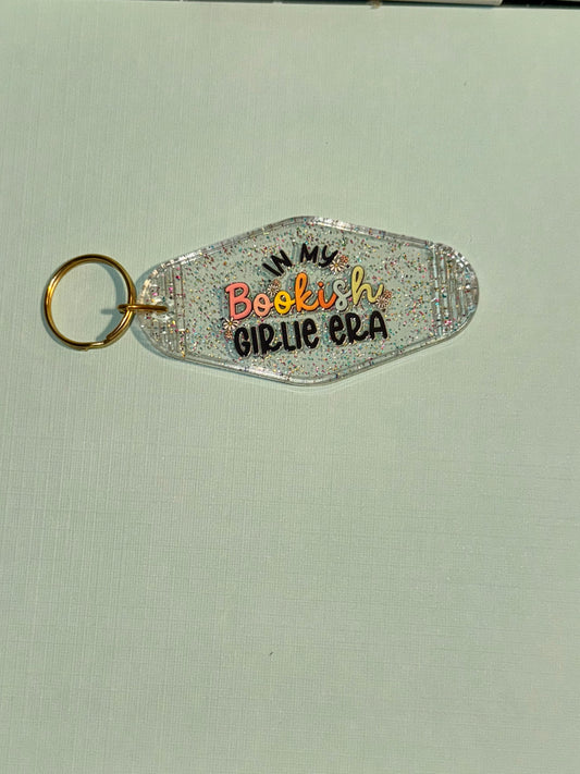 Glitter in my book era motel keychain